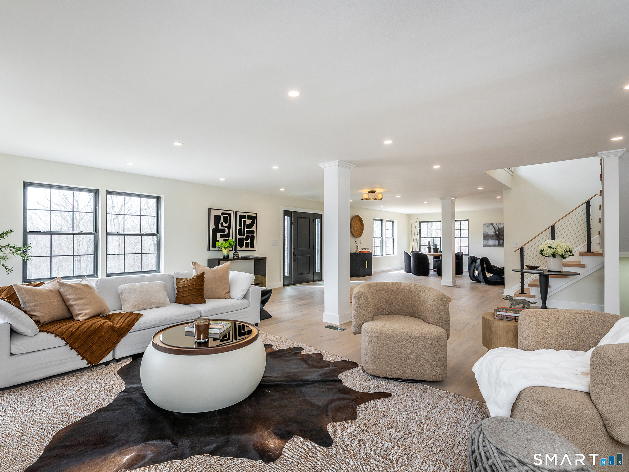 53 Mountain Lake Road Warren, CT 06777 - Photo 5 of 40 a living room with furniture and a large window