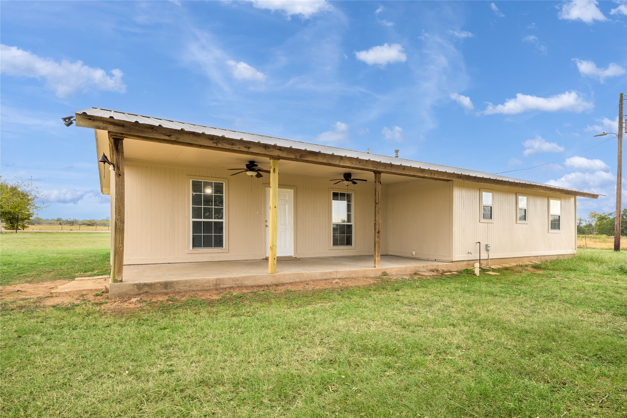 174 Easley Road Smithville, TX 78957 - Photo 12 of 28 a front view of a house with garden