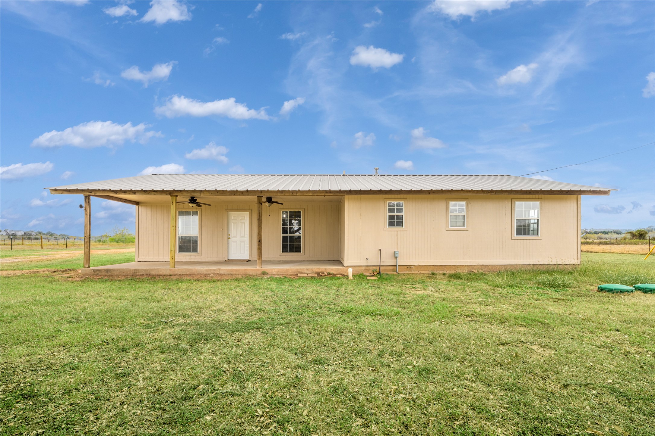 174 Easley Road Smithville, TX 78957 - Photo 13 of 28 a view of a big yard with table and chairs