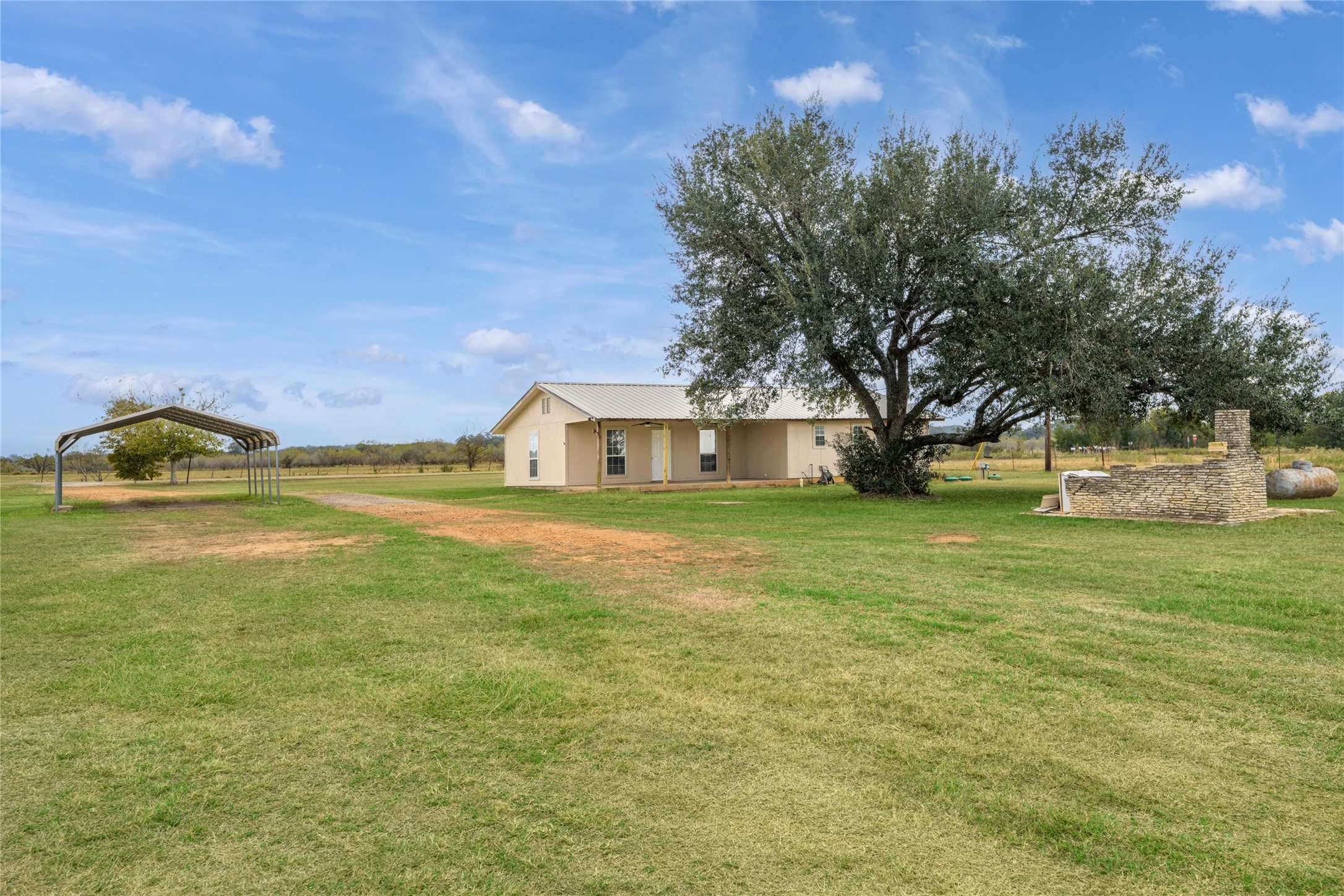 174 Easley Road Smithville, TX 78957 - Photo 15 of 28 a house view with a garden space