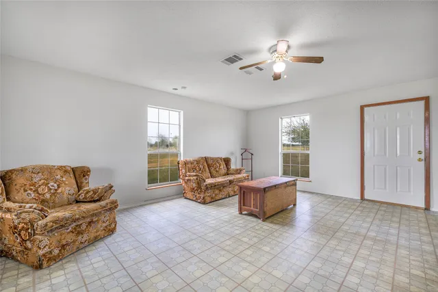 a living room with furniture and window