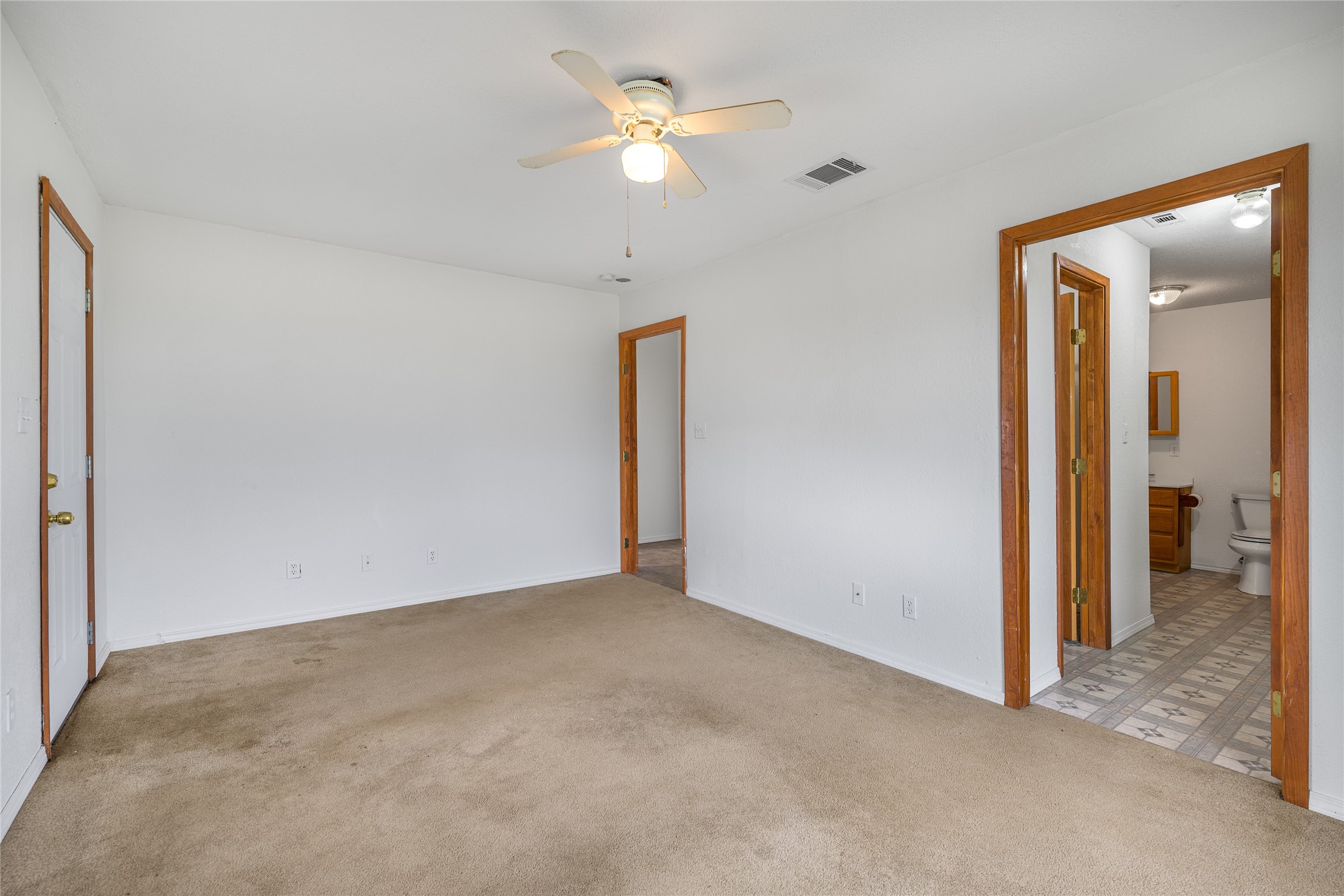 174 Easley Road Smithville, TX 78957 - Photo 23 of 28 a view of an empty room with a ceiling fan