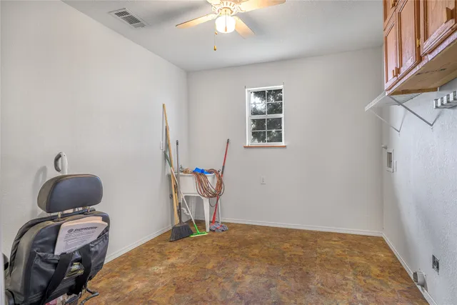 a bedroom with bed and a window