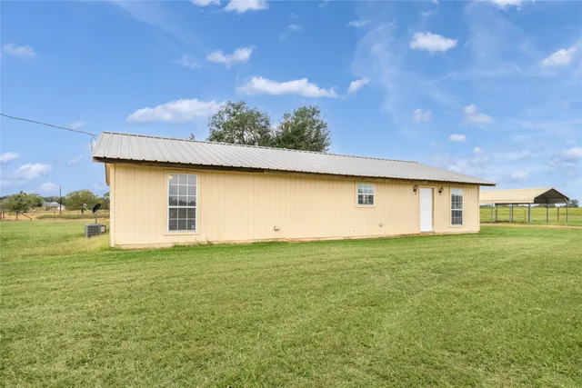 a view of a house with a big yard