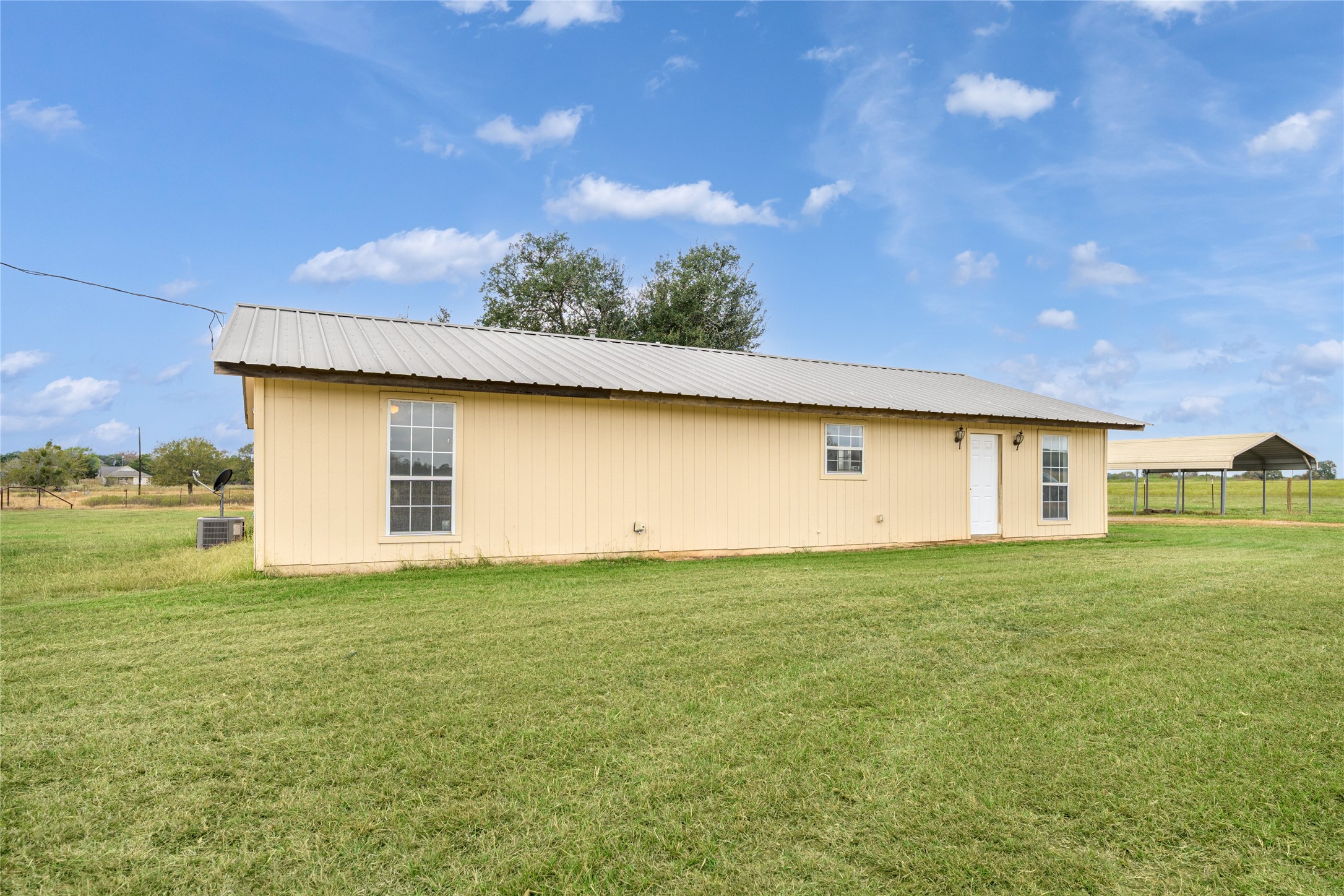 174 Easley Road Smithville, TX 78957 - Photo 10 of 28 a view of a house with a big yard