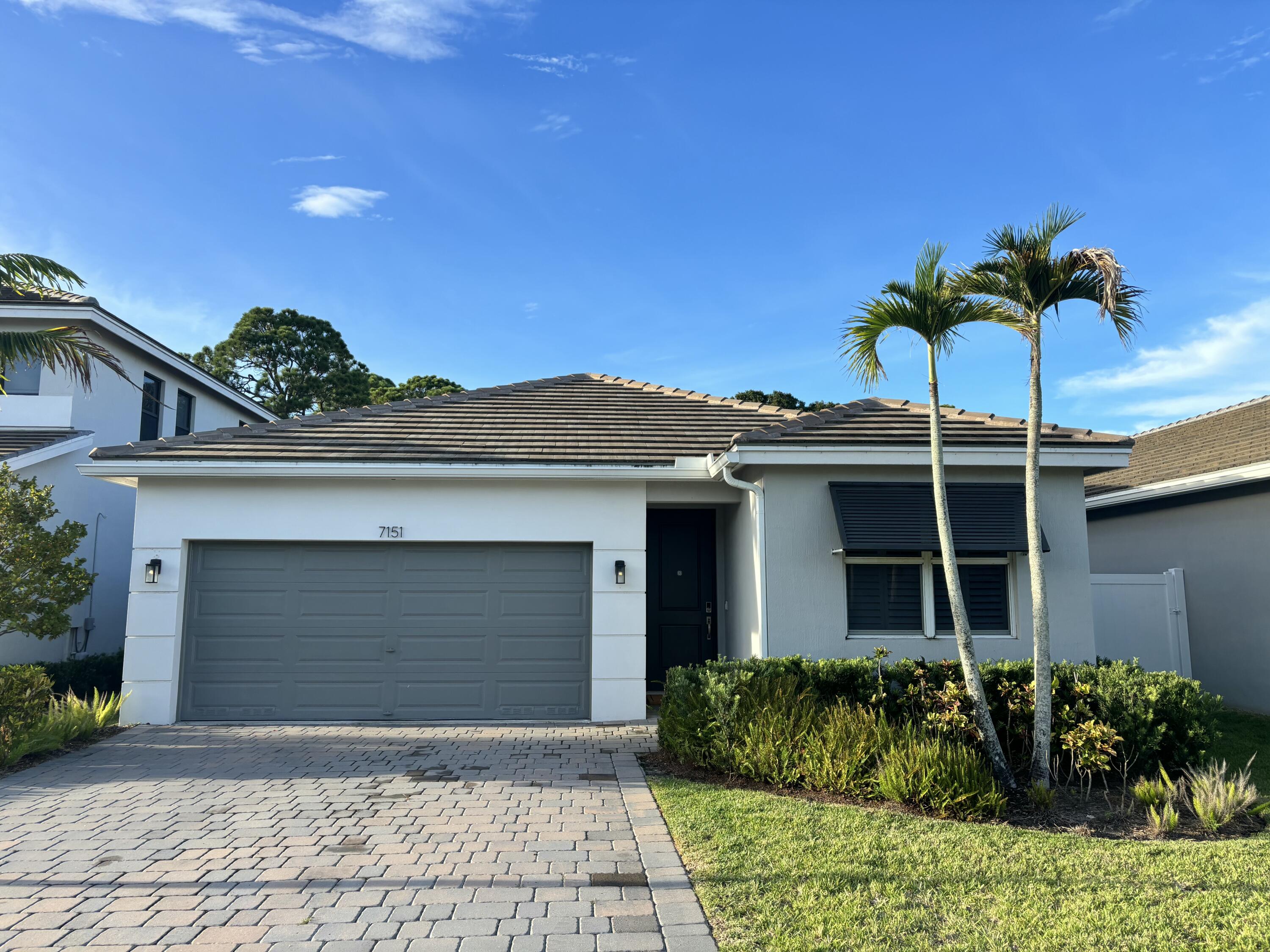 7151 Rockwood Road Jupiter, FL 33458 - Photo 1 of 74 Front of House