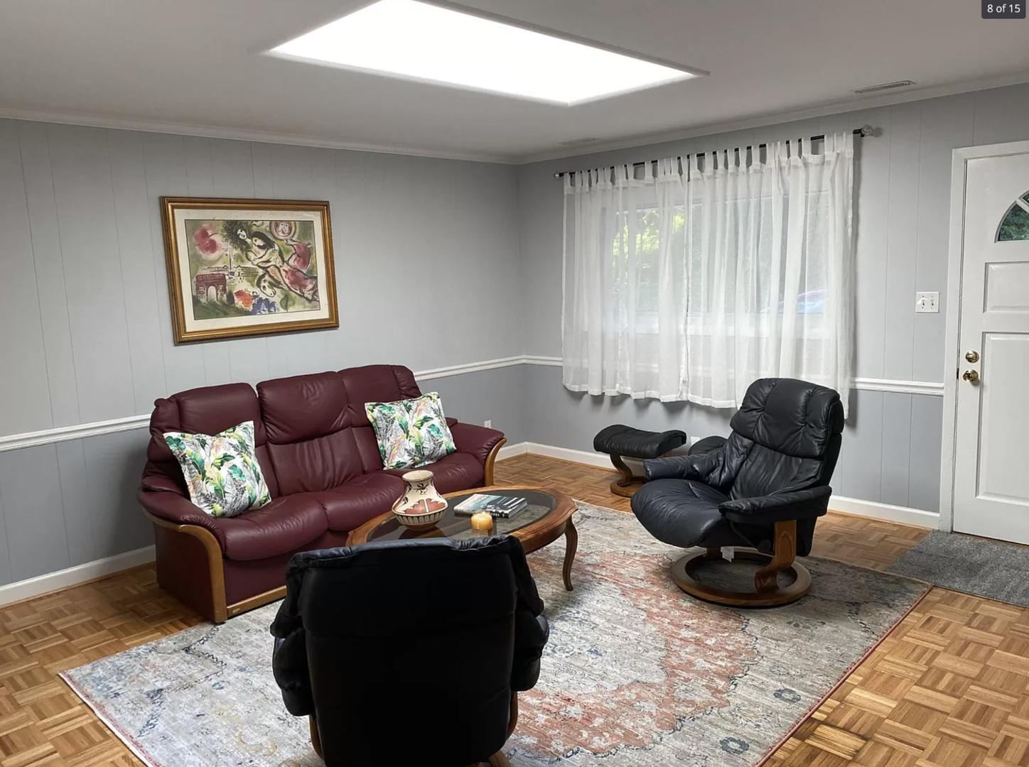 1416 Old Lystra Road, Unit 2 Chapel Hill, NC 27517 - Photo 5 of 12 a living room with furniture rug and a window