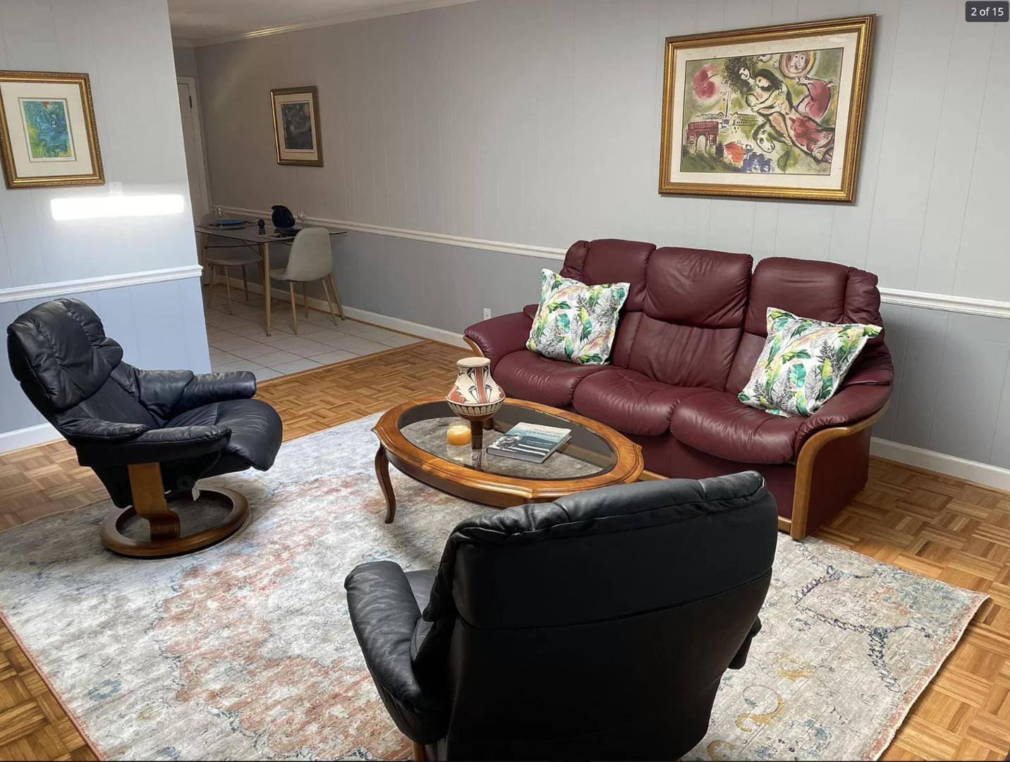 1416 Old Lystra Road, Unit 2 Chapel Hill, NC 27517 - Photo 6 of 12 a living room with furniture a rug and a lamp