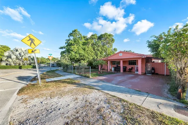 a view of a house with basketball court