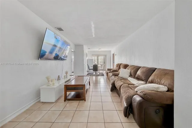 a living room with furniture and a couch