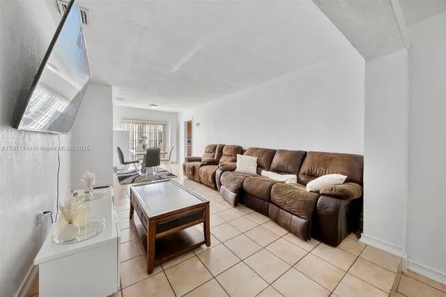 a living room with furniture and a couch