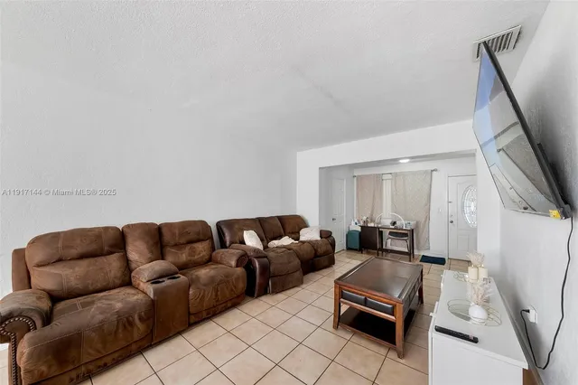 a living room with furniture and a couch