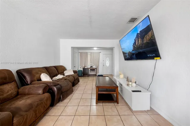 a living room with furniture and a couch