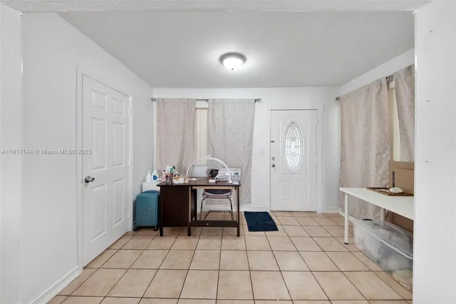 a view of room with window and furniture