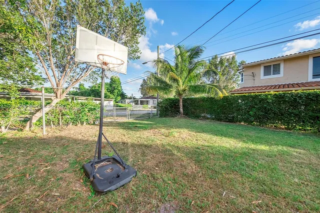 a backyard of a house with lots of green space