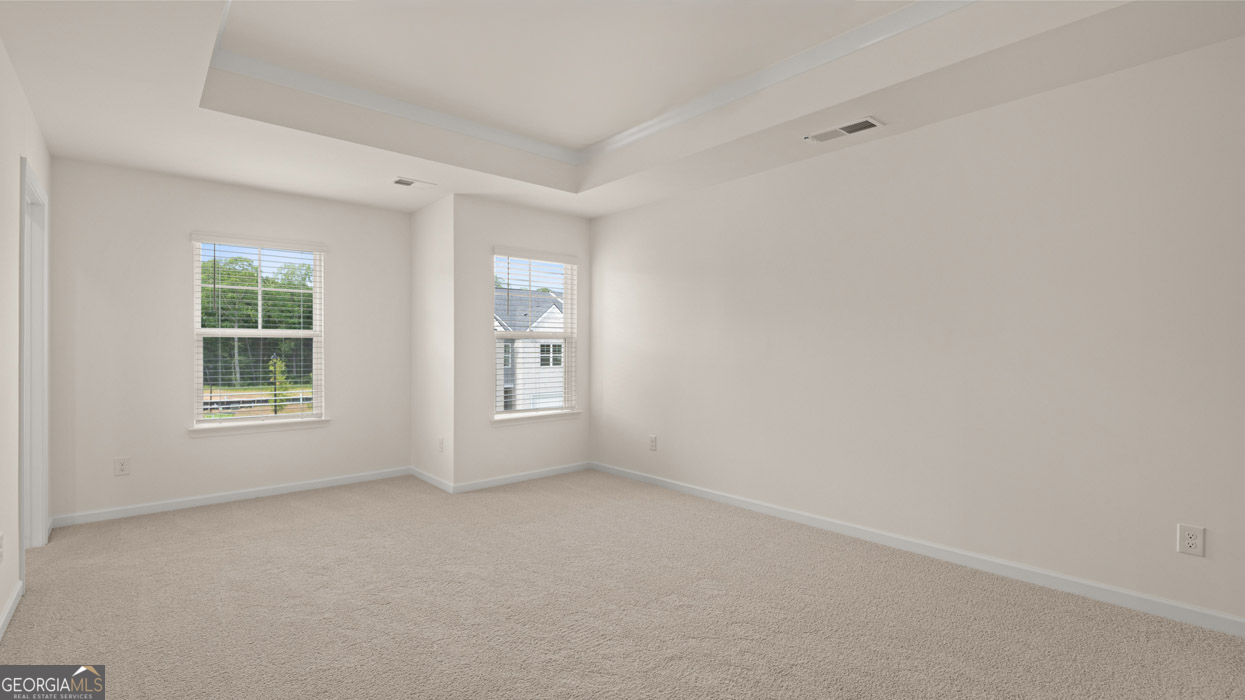 265 Sound Circle, Unit 152 Stockbridge, GA 30281 - Photo 18 of 54 an empty room with windows