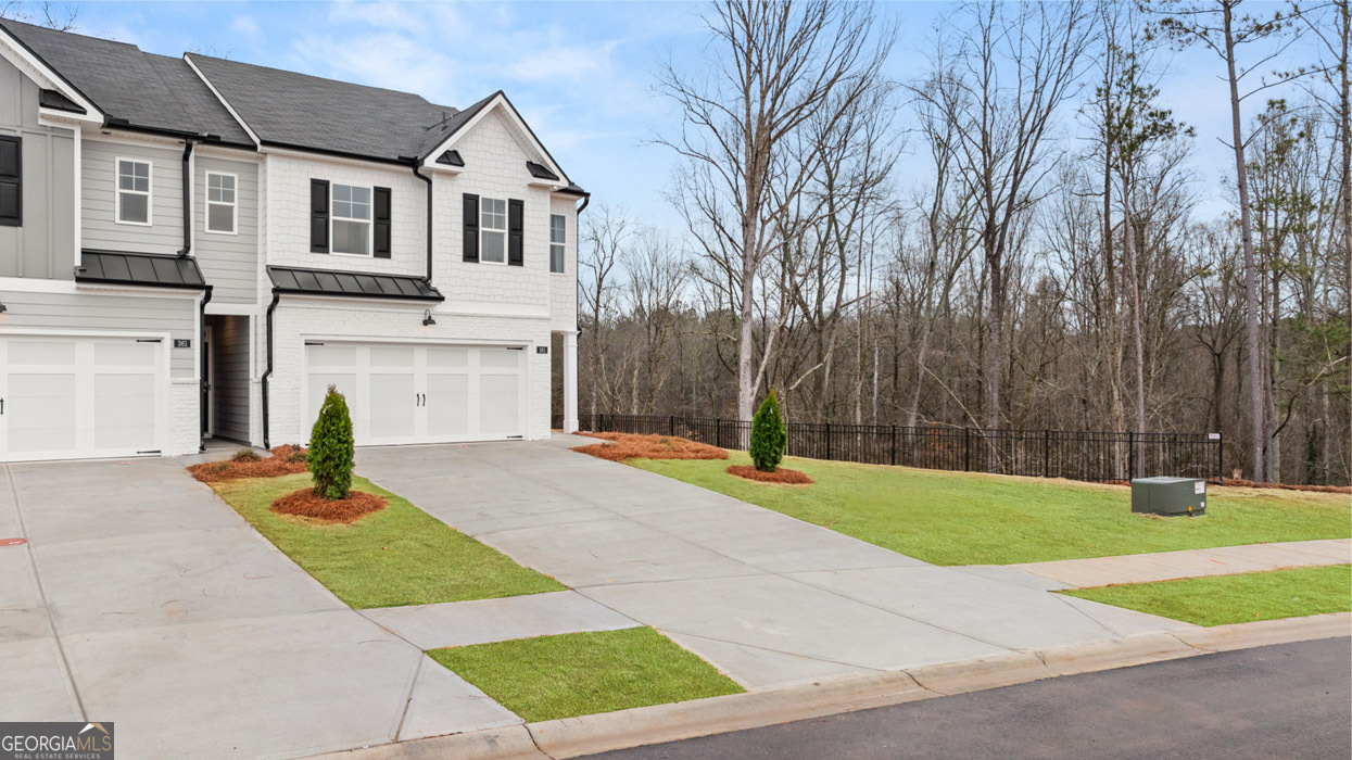 265 Sound Circle, Unit 152 Stockbridge, GA 30281 - Photo 2 of 54 a house view with a outdoor space