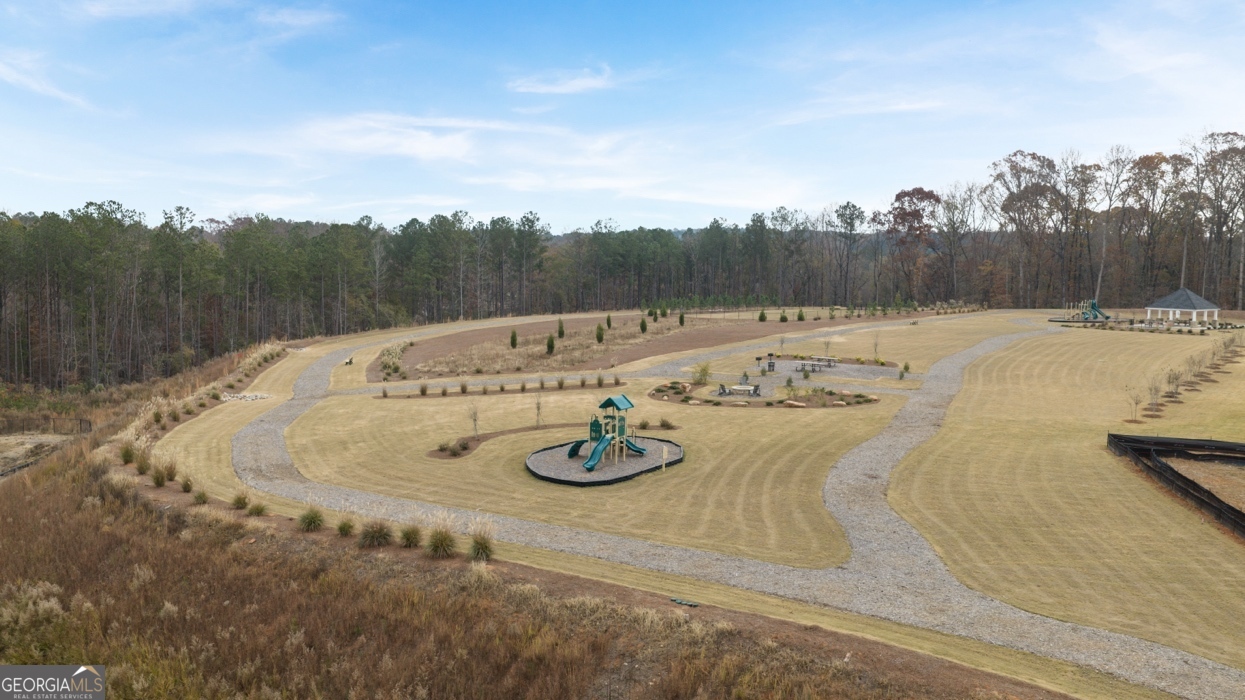 265 Sound Circle Stockbridge, GA 30281 - Photo 26 of 30 a view of a swimming pool with a yard