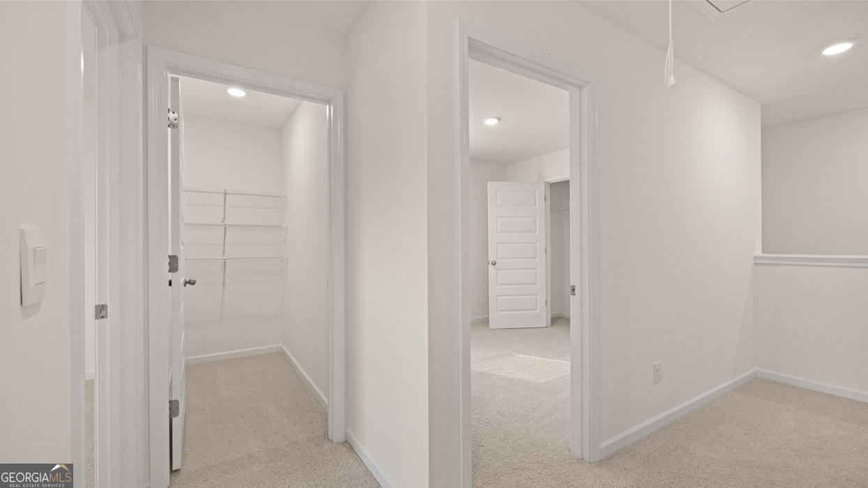 265 Sound Circle, Unit 152 Stockbridge, GA 30281 - Photo 28 of 54 an empty room with closet and a bathroom