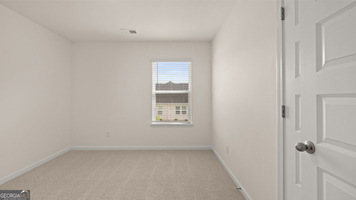 265 Sound Circle, Unit 152 Stockbridge, GA 30281 - Photo 29 of 54 a view of an empty room with a window