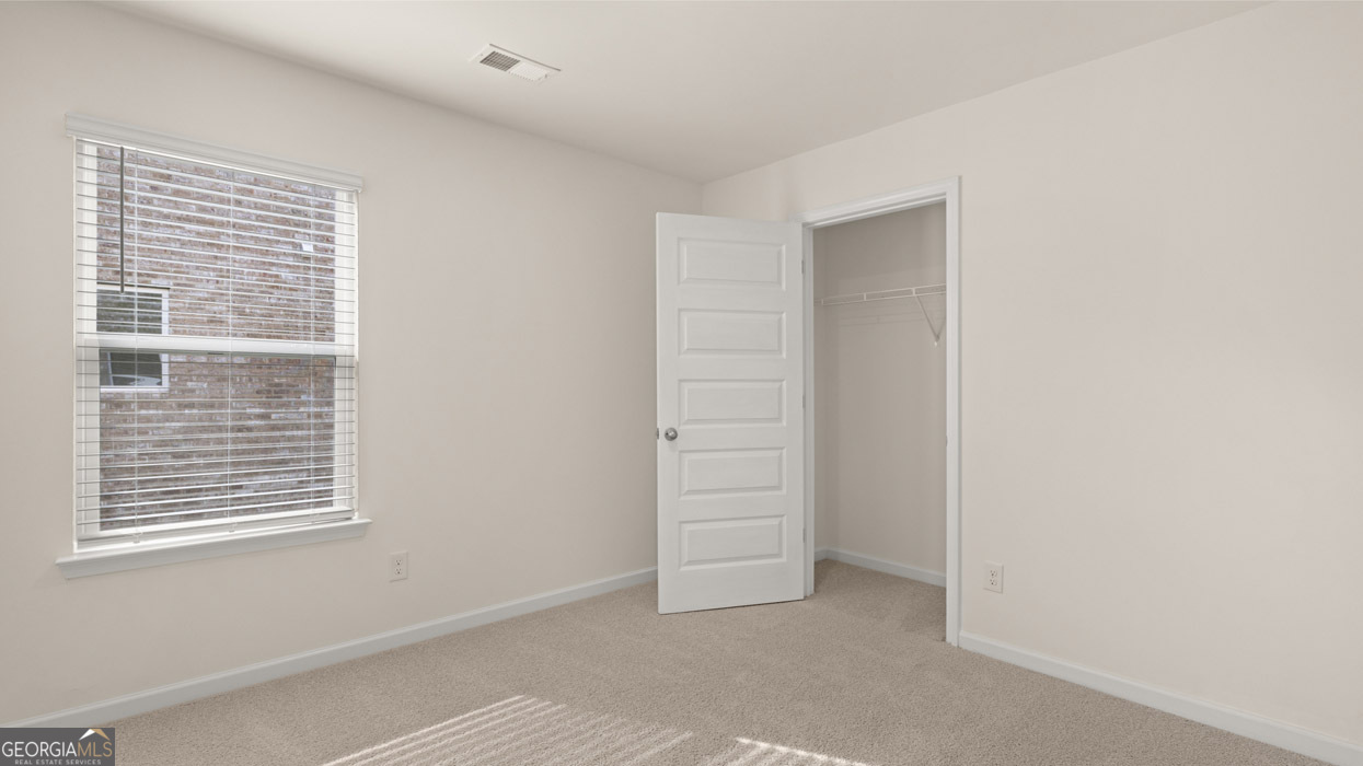 265 Sound Circle, Unit 152 Stockbridge, GA 30281 - Photo 35 of 54 a view of an empty room with a window