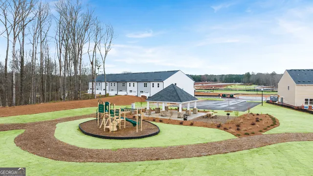 a view of a house with backyard and a slide