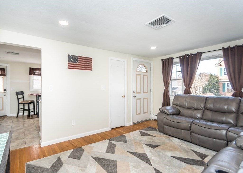 89 Pine Hill Circle Waltham, MA 02451 - Photo 12 of 32 a living room with furniture and a window