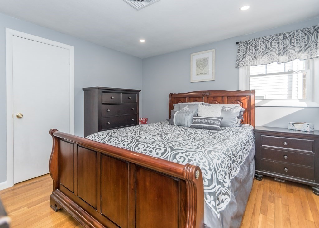 89 Pine Hill Circle Waltham, MA 02451 - Photo 14 of 32 a bedroom with a bed and window