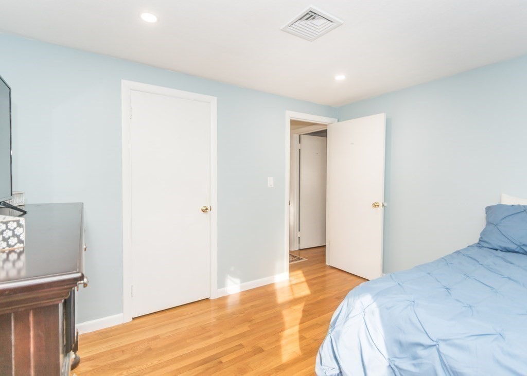 89 Pine Hill Circle Waltham, MA 02451 - Photo 17 of 32 a bedroom with a bed and a window