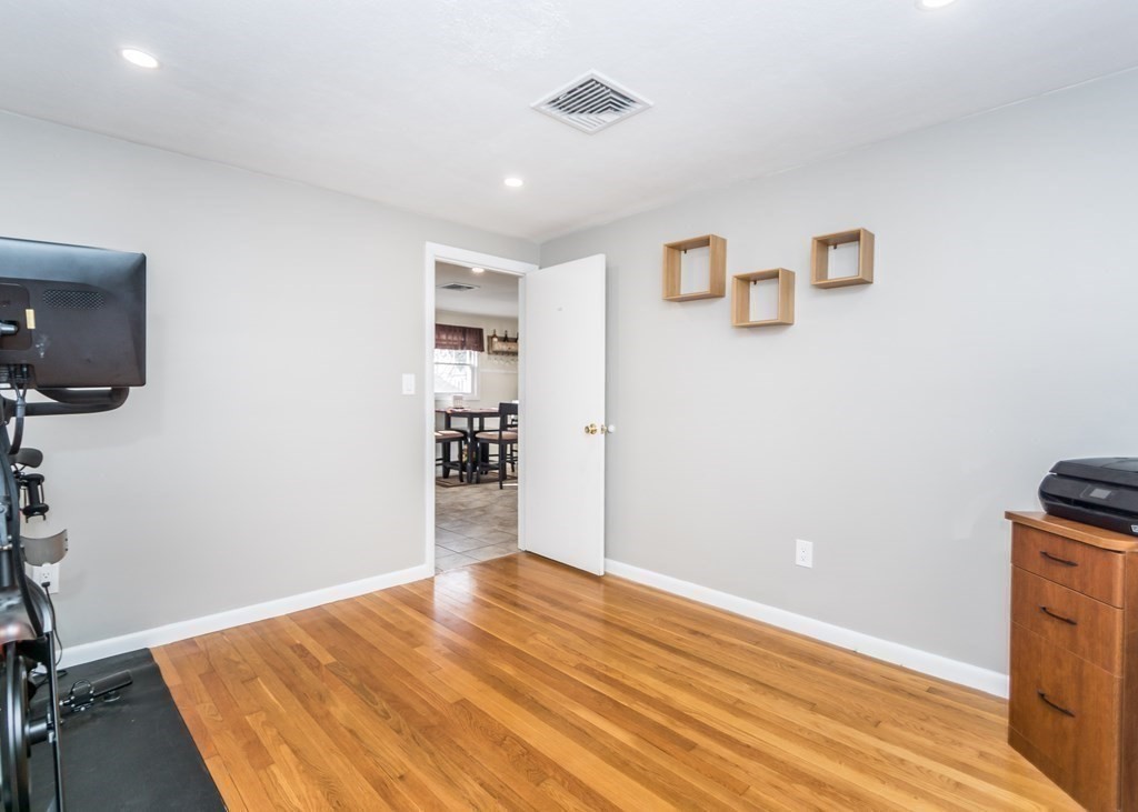 89 Pine Hill Circle Waltham, MA 02451 - Photo 19 of 32 a view of empty room with wooden floor