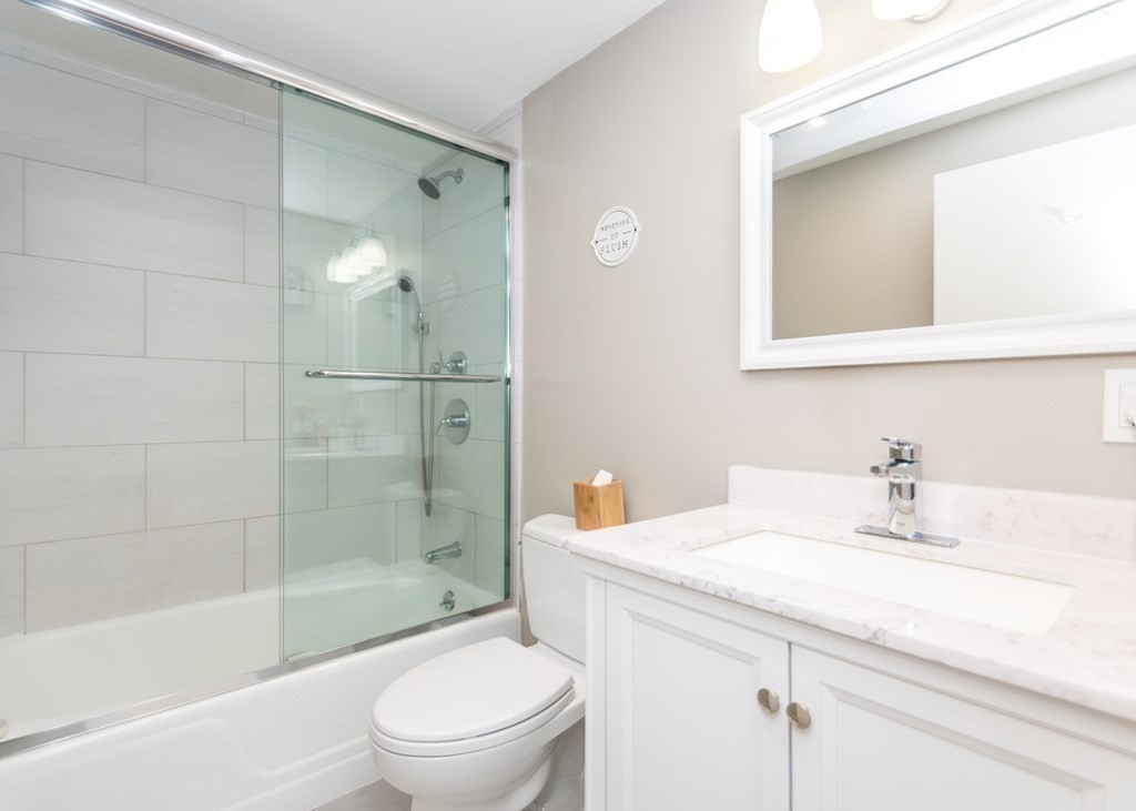 89 Pine Hill Circle Waltham, MA 02451 - Photo 20 of 32 a bathroom with a sink toilet and shower