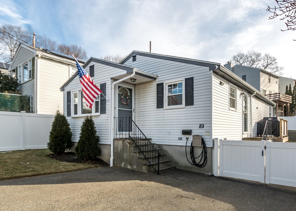 89 Pine Hill Circle Waltham, MA 02451 - Photo 25 of 32 a view of a house with a patio