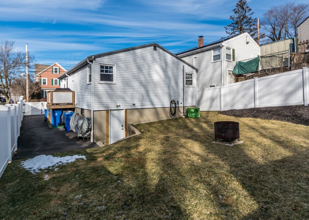 89 Pine Hill Circle Waltham, MA 02451 - Photo 26 of 32 a view of a house with a park