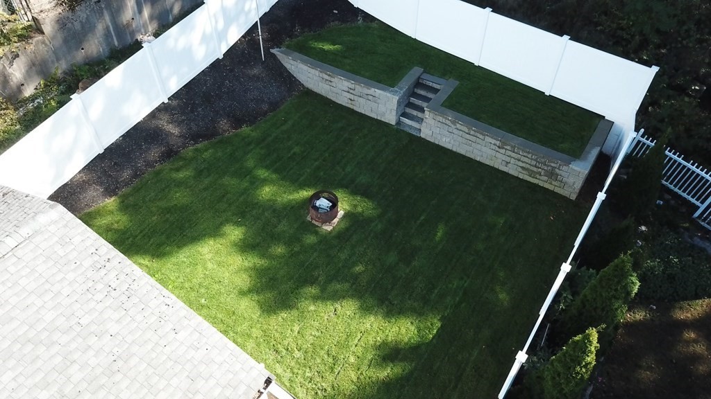 89 Pine Hill Circle Waltham, MA 02451 - Photo 30 of 32 a view of a backyard of the house