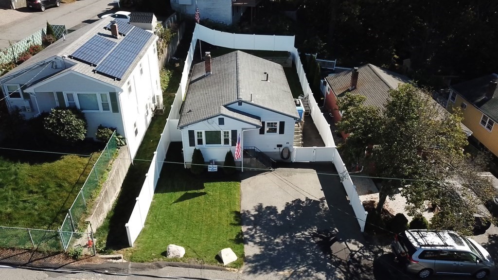 89 Pine Hill Circle Waltham, MA 02451 - Photo 31 of 32 an aerial view of a house with a swimming pool
