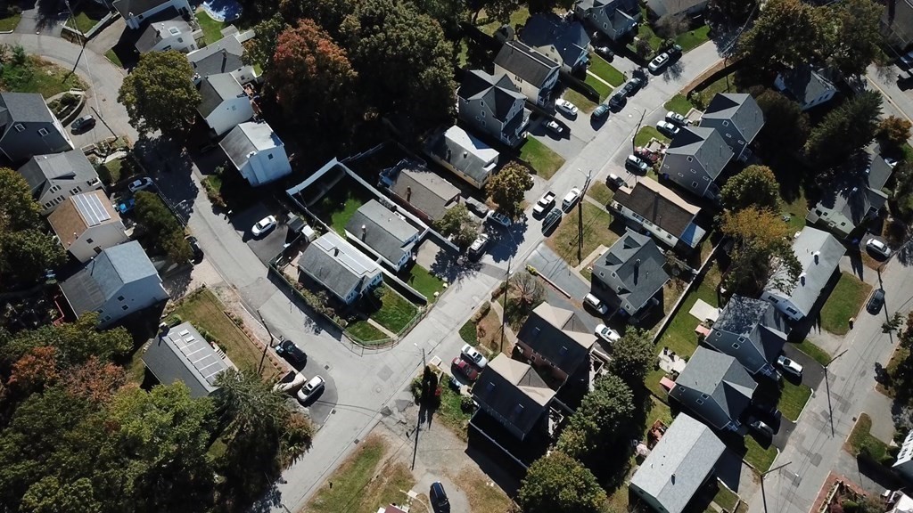89 Pine Hill Circle Waltham, MA 02451 - Photo 32 of 32 an aerial view of a residential building with outdoor space and parking