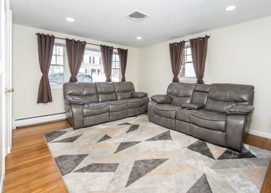 89 Pine Hill Circle Waltham, MA 02451 - Photo 9 of 32 a living room with furniture and a rug