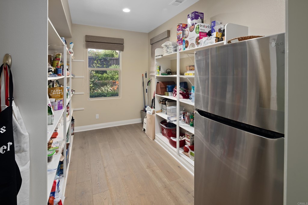 698 Normandy Road Encinitas, CA 92024 - Photo 11 of 35 a view of walk in closet with clothes and shoes