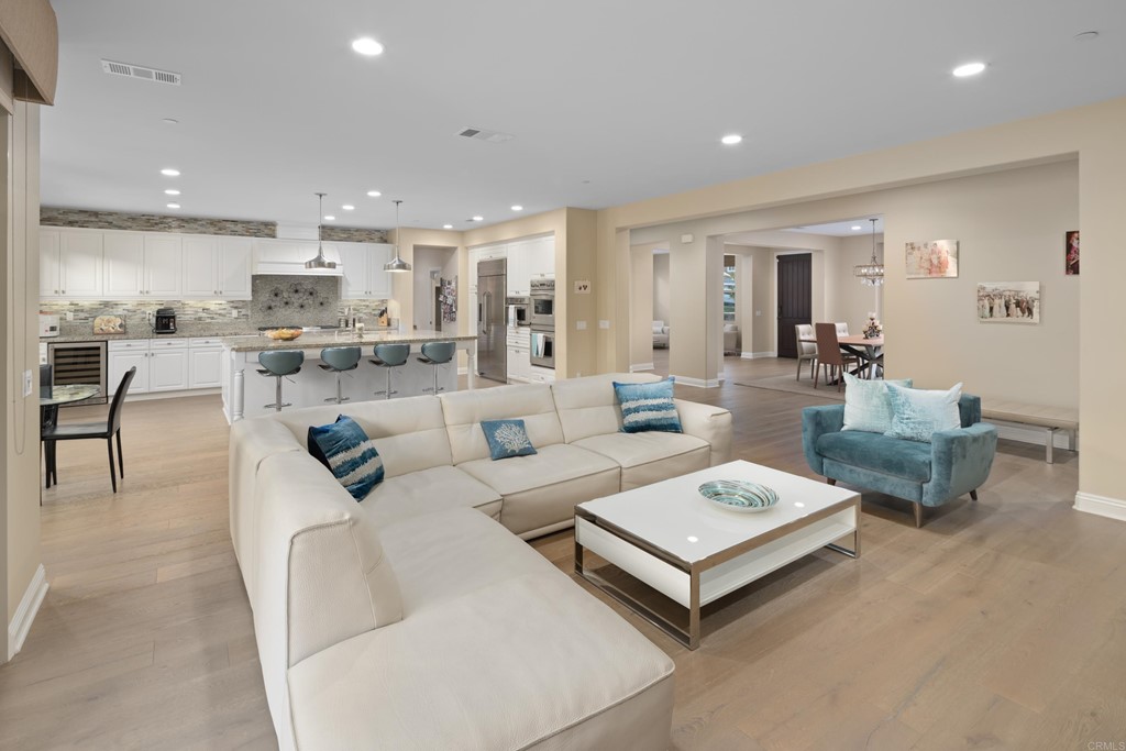 698 Normandy Road Encinitas, CA 92024 - Photo 12 of 35 a living room with furniture and a view of kitchen