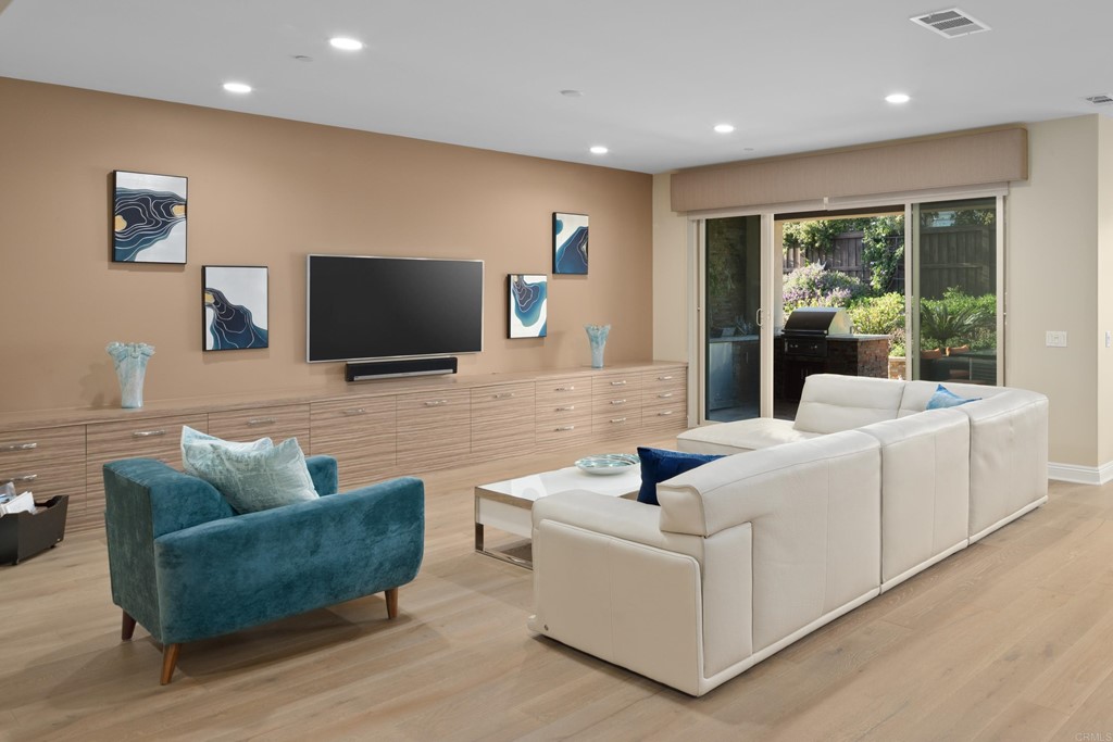 698 Normandy Road Encinitas, CA 92024 - Photo 13 of 35 a living room with couches and a flat screen tv