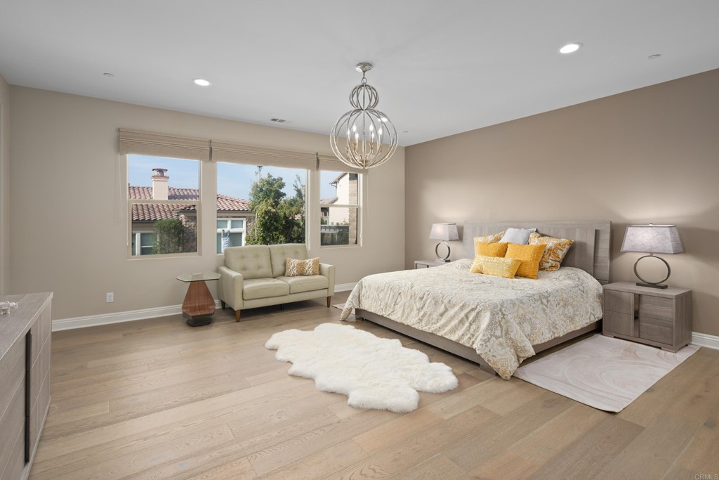 698 Normandy Road Encinitas, CA 92024 - Photo 23 of 35 a bedroom with a bed couch and window