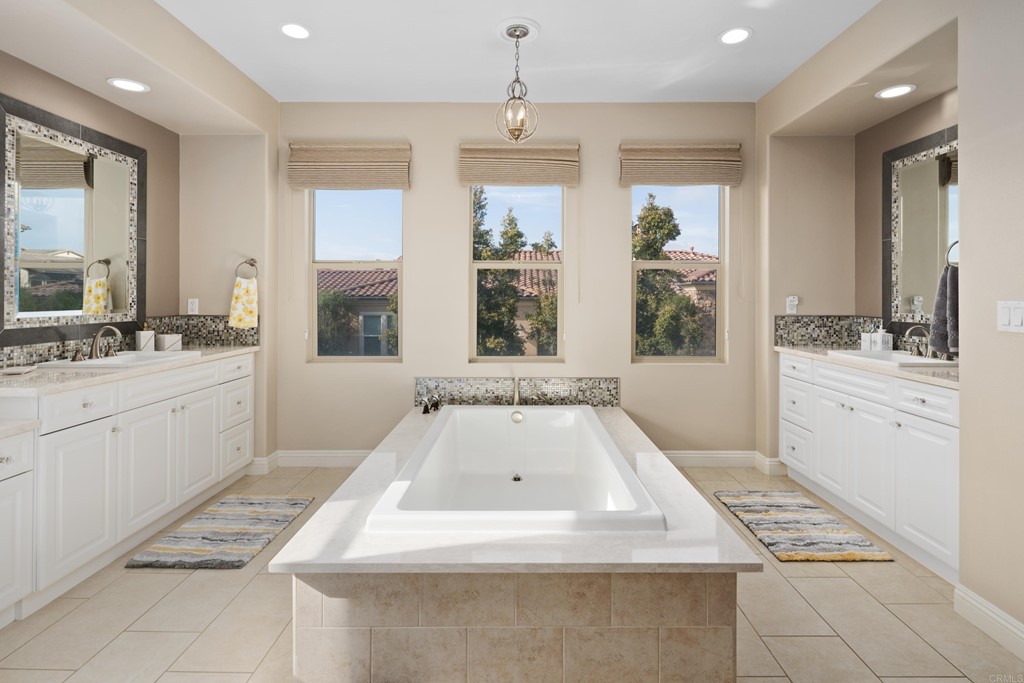 698 Normandy Road Encinitas, CA 92024 - Photo 24 of 35 a bathroom with a sink a vanity and a mirror
