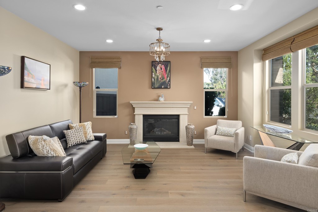 698 Normandy Road Encinitas, CA 92024 - Photo 3 of 35 a living room with furniture and a fireplace