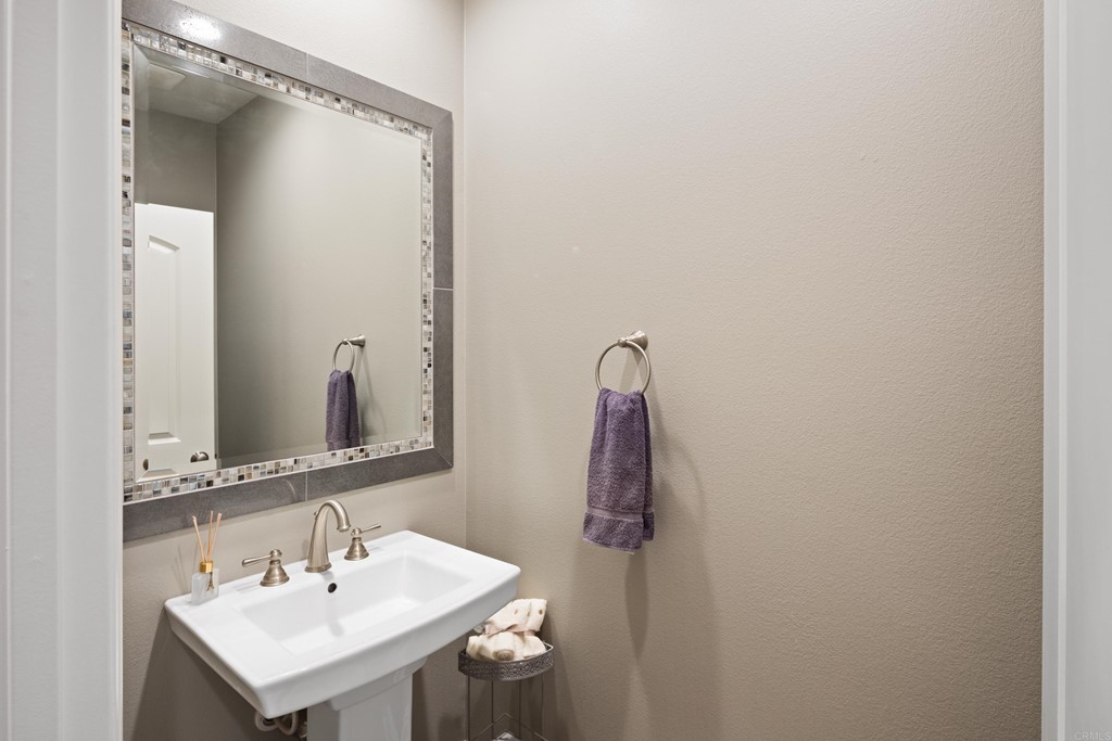 698 Normandy Road Encinitas, CA 92024 - Photo 7 of 35 a bathroom with a sink and a mirror