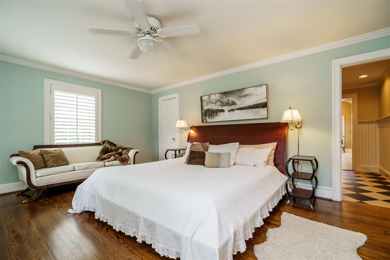 1501 St Marys Street Raleigh, NC 27608 - Photo 14 of 30 Hardwood floors, plantation shutters, and soothing fan for a good night's sleep. Spacious Owner's Suite