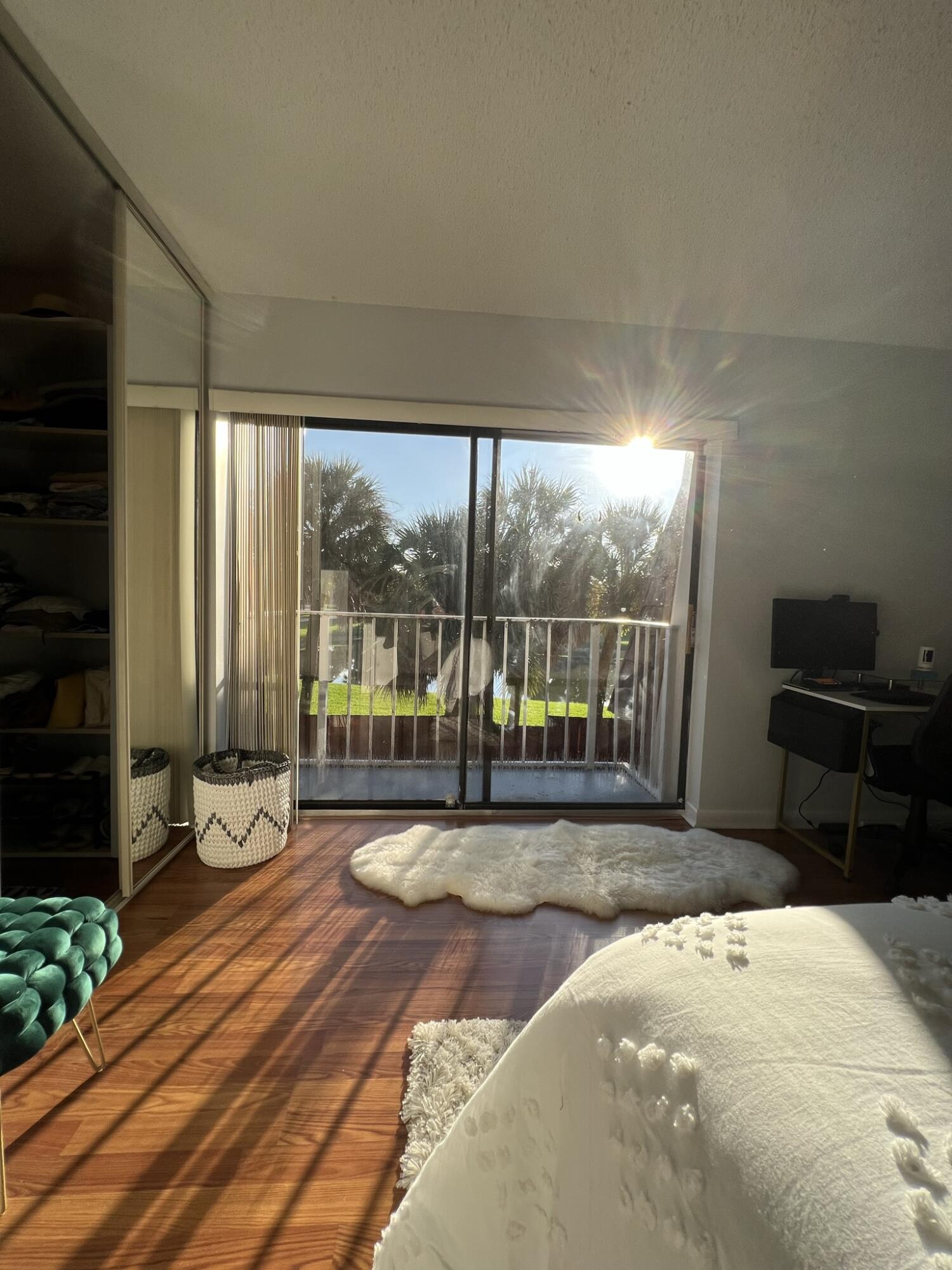 802 Blue Ridge Circle West Palm Beach, FL 33409 - Photo 23 of 37 a bedroom with a bed and large window