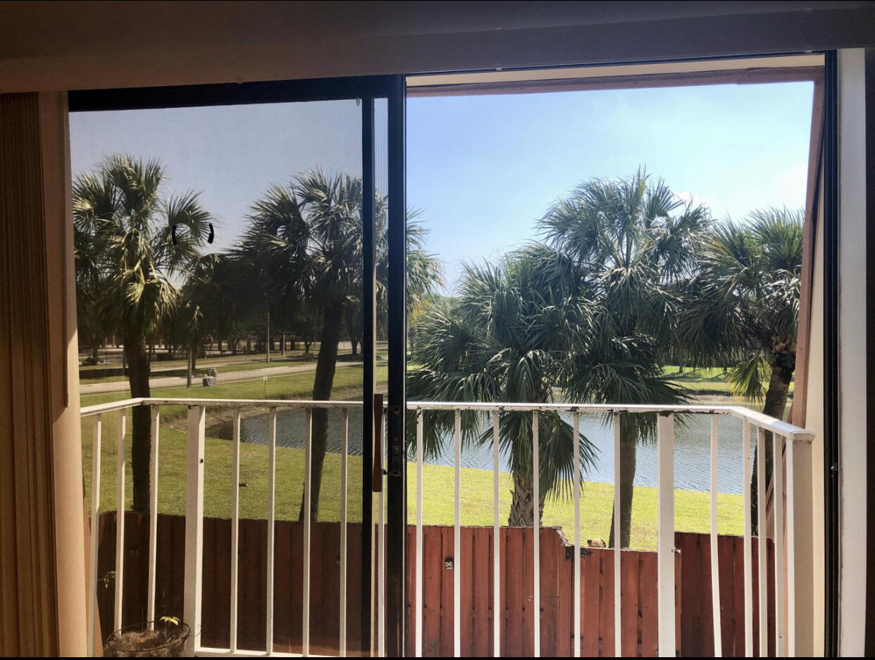 802 Blue Ridge Circle West Palm Beach, FL 33409 - Photo 24 of 37 a view of a swimming pool with a yard from a balcony