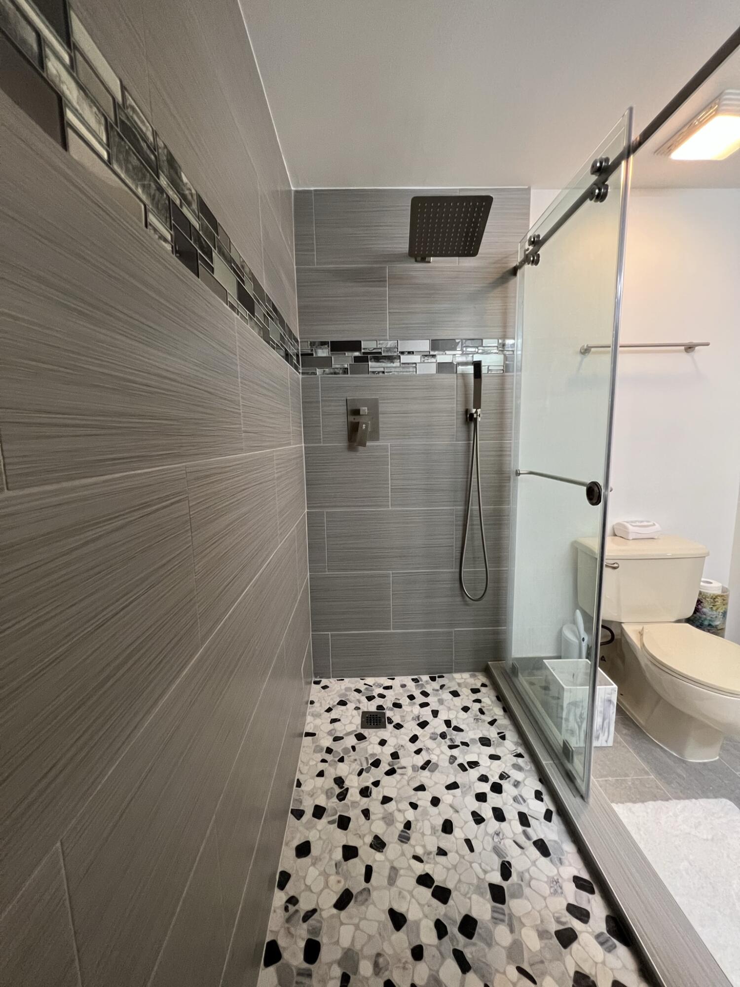 802 Blue Ridge Circle West Palm Beach, FL 33409 - Photo 31 of 37 a bathroom with a glass door shower