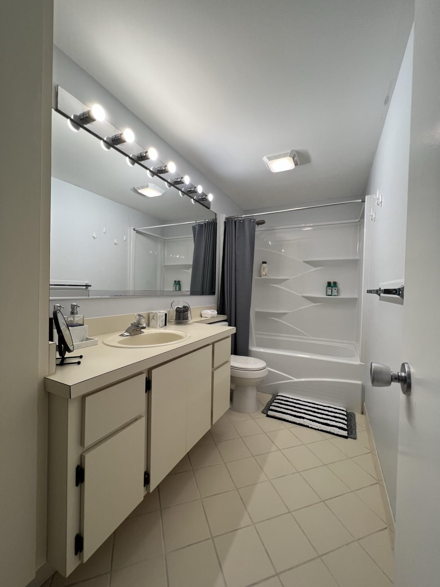 802 Blue Ridge Circle West Palm Beach, FL 33409 - Photo 36 of 37 a bathroom with a sink a toilet and shower