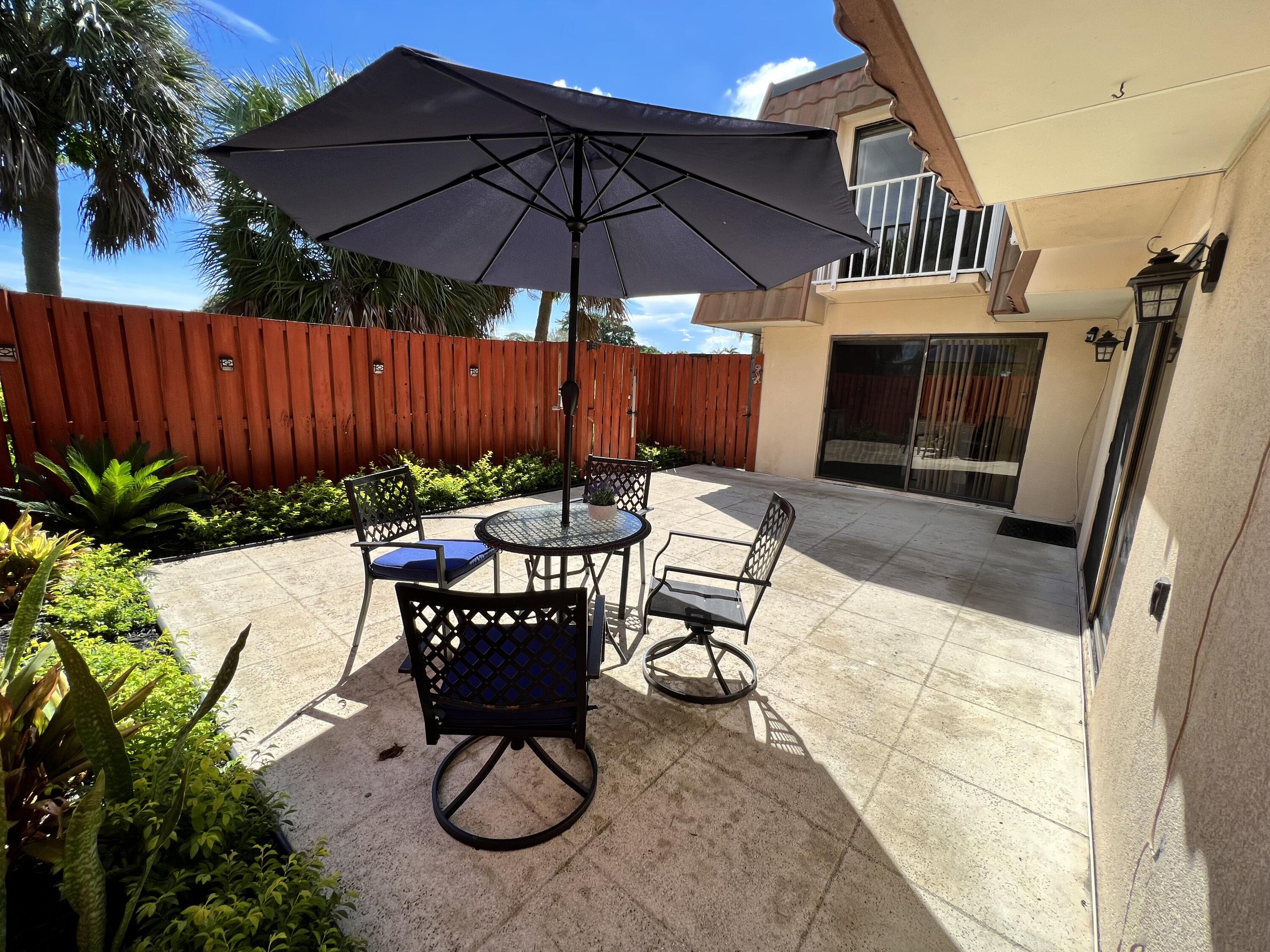 802 Blue Ridge Circle West Palm Beach, FL 33409 - Photo 5 of 37 a view of a backyard with furniture and a tub